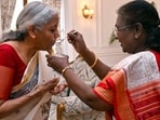 President Droupadi Murmu fed Union Finance Minister Nirmala Sitharaman the customary 'dahi-cheeni' (curd and sugar) before presenting the Union Budget 2025, at Rashtrapati Bhavan in New Delhi on Saturday.(ANI)